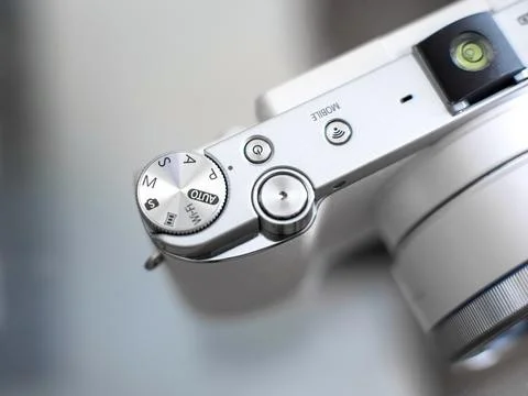 Top view of a white comact camera with device buttons function isolated. Stock Photos