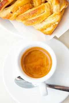 Top view to white cup of coffee ristretto and croissant. Traditional italian Stock Photos