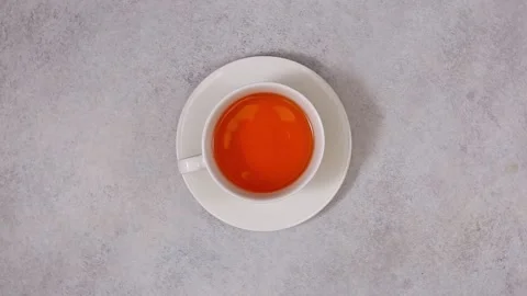 Top view of white cup of tea. White stone background, top view Stock Footage 204158830