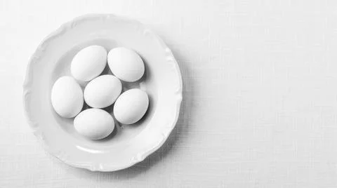 Top view white eggs plate with copy space. High quality and resolution beautiful Stock Photos