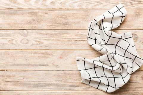 Top view with white empty kitchen napkin isolated on table background. Folded Stock Photos