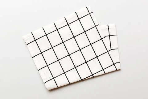 Top view with white empty kitchen napkin isolated on table background. Fold.. Stock Photos