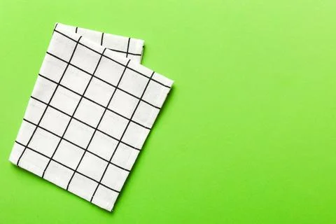 Top view with white empty kitchen napkin isolated on table background. Folded Stock Photos