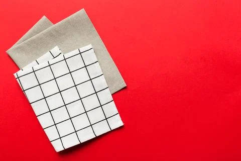 Top view with white empty kitchen napkin isolated on table background. Folded Stock Photos