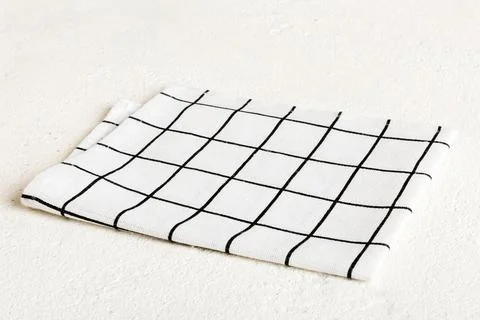 Top view with white empty kitchen napkin isolated on table background. Folded Stock Photos