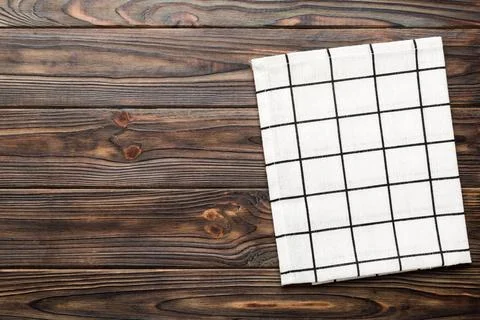 Top view with white empty kitchen napkin isolated on table background. Fold.. Stock Photos