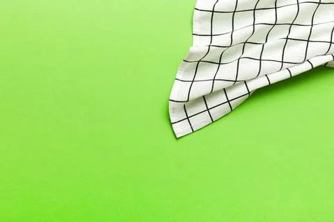 Top view with white empty kitchen napkin isolated on table background. Folded Stock Photos
