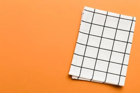 Top view with white empty kitchen napkin isolated on table background. Folded Stock Photos