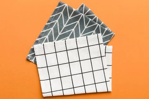 Top view with white empty kitchen napkin isolated on table background. Folded Stock Photos