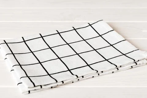 Top view with white empty kitchen napkin isolated on table background. Folded Stock Photos