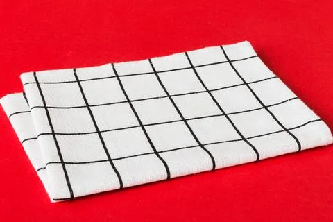 Top view with white empty kitchen napkin isolated on table background. Folded Stock Photos