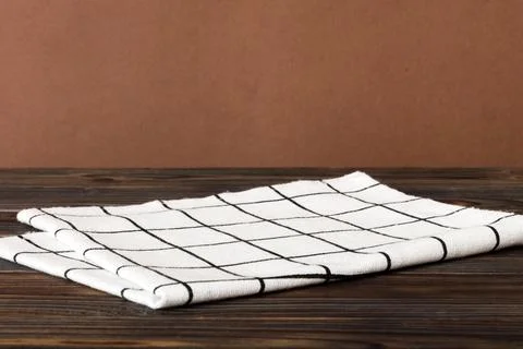 Top view with white empty kitchen napkin isolated on table background. Fold.. Stock Photos