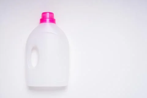 Top view white empty plastic cleaning product bottle with pink lid on white b Stock Photos