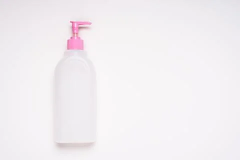 Top view white empty plastic cleaning product bottle with pink lid and dispen Stock Photos