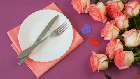 Top view of white empty plate and many pink roses and mother's day card Stock Footage 147438550