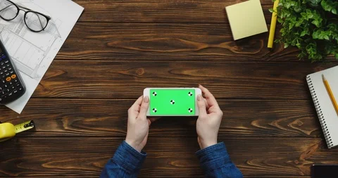 Top view on the white horizontal smartphone on the wooden table of architect and Stock-Footage 96180753