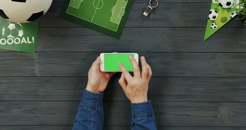 Top view on the white horizontal smartphone on the dark grey wooden desk of Stock Footage 96447389