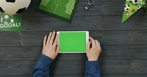 Top view on the white horizontal tablet computer on the dark grey wooden desk of Video stock 96442326