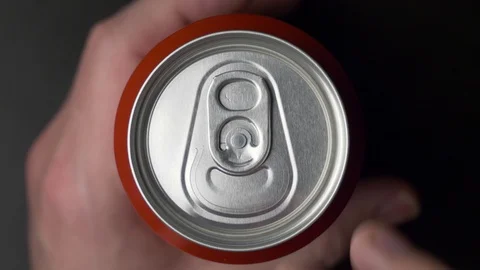 Top view of white man open red can of soda or beer Stock Footage