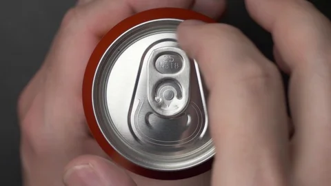 Top view of white man open red can of soda or beer Stock Footage 106743077
