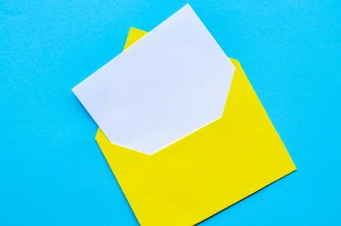 Top view of white notepad with envelope on blue cover background with custo.. Stock Photos