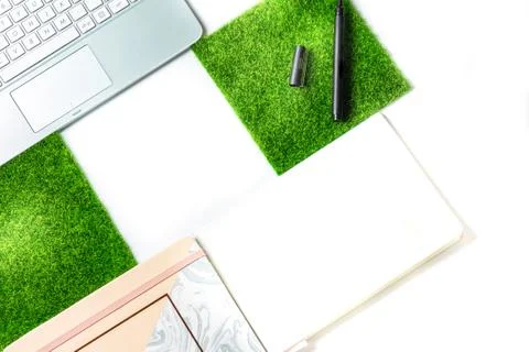 Top view of white office table with laptop, smartphone and supplies. Stock Photos