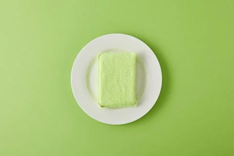 Top view white plate sponge Stock Photos
