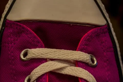 Top view of the white rubber tip of the sports shoe whit white shoelaces. Stock Photos
