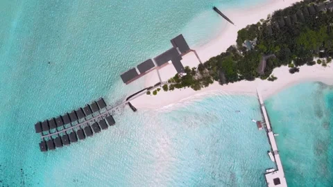Top view of white sand, blue lagoon, Maldives island resort. Water bungalows. Stock Footage 145066172