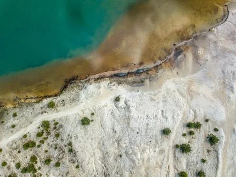 Top view at a white sanded beach and turquise water. Stock Photos