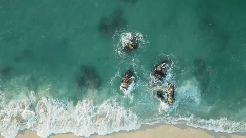 Top view of a white sandy beach with clear azure water Stock Footage 245255400