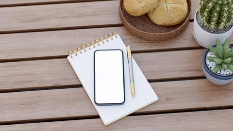 Top view of white screen smartphone and golden pen on notebook with pot pla.. Stock Illustration