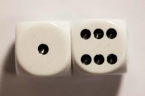 Top view of a white set of dice showing a seven 스톡 사진