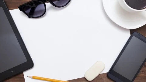 Top view on a white sheet and electronic device Stock-Footage 73953698