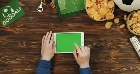 Top view on the white tablet device in male hands being horizontally on the Stock Footage 96317487