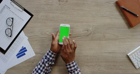Top view on the white vertical smartphone on the wooden light desk and African Stock-Footage 96014618