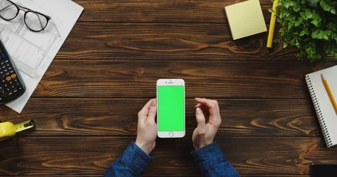 Top view on the white vertical smartphone on the wooden table of architect and 스톡 동영상 96180309