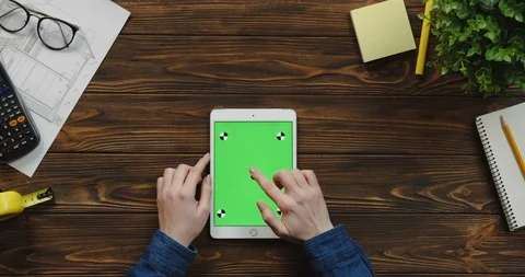 Top view on the white vertical tablet computer on the wooden table of architect Stock Footage 96181892