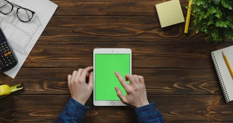 Top view on the white vertical tablet computer on the wooden table of architect Stock Footage 96182038