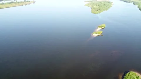 Top view of a wide full-flowing river with islands Stock Footage 143522666