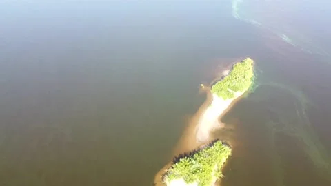 Top view of a wide full-flowing river with islands Stock Footage 143522673