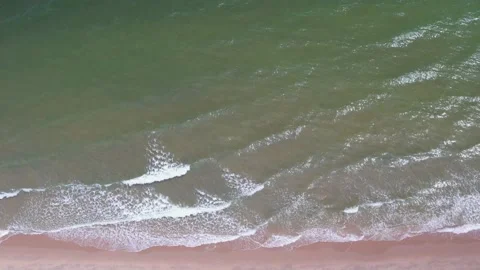Top view wide ocean landscape, wave water many white foam breaking on sand beach Stock Footage 221214772