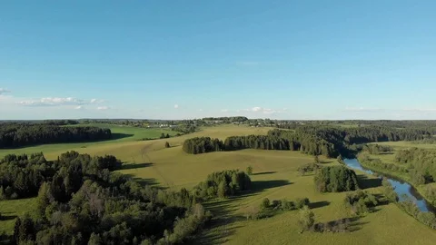 Top view of the winding river flowing through fields and forests Stock-Footage 111934554