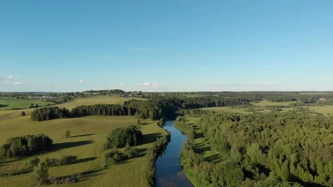 Top view of the winding river flowing through fields and forests Stock-Footage 111934619