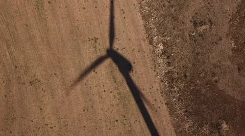 Top view of windmill shadow over cultivated land Video stock 62912539