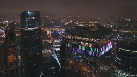 Top view winter of the city in the low clouds skyscrapers Moscow city at night 動画素材 104301513