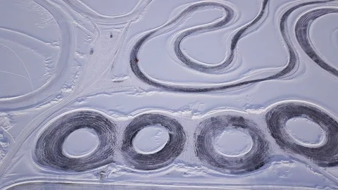 Top view of the winter racing track with driving cars, extreme and dangerous Stock Footage 128829980