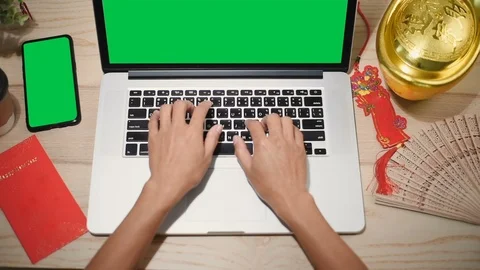 Top view of woman hand using laptop computer with a key green screen set on work Stock Footage 103368439