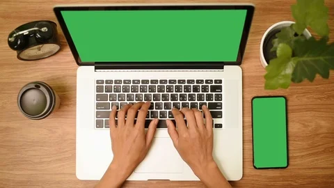 Top view of woman hand using laptop computer with a key green screen set on work Stock Footage 103371941