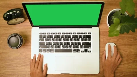 Top view of woman hand using laptop computer with a key green screen set on work Stock Footage 103383865